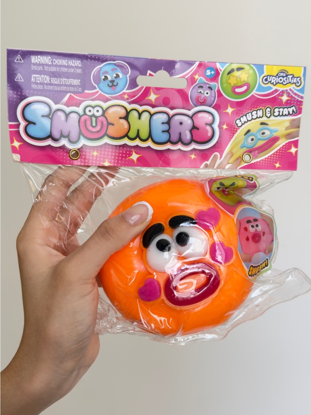 Orb Curiosities Orange Smushers Squishy Face Toy